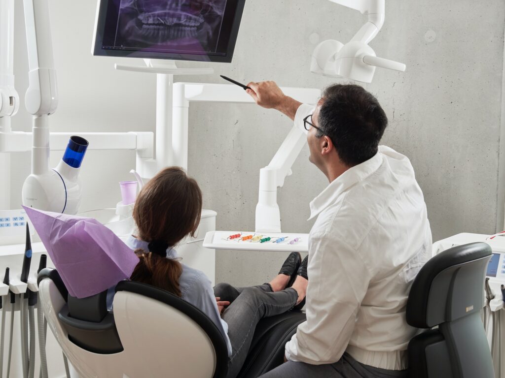 Dentist uses digital x-rays to check the the detailed view of the teeth